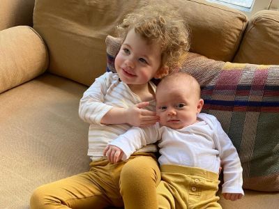 Both Ezer Billie White and Dolores Wild White are lying together in a sofa.